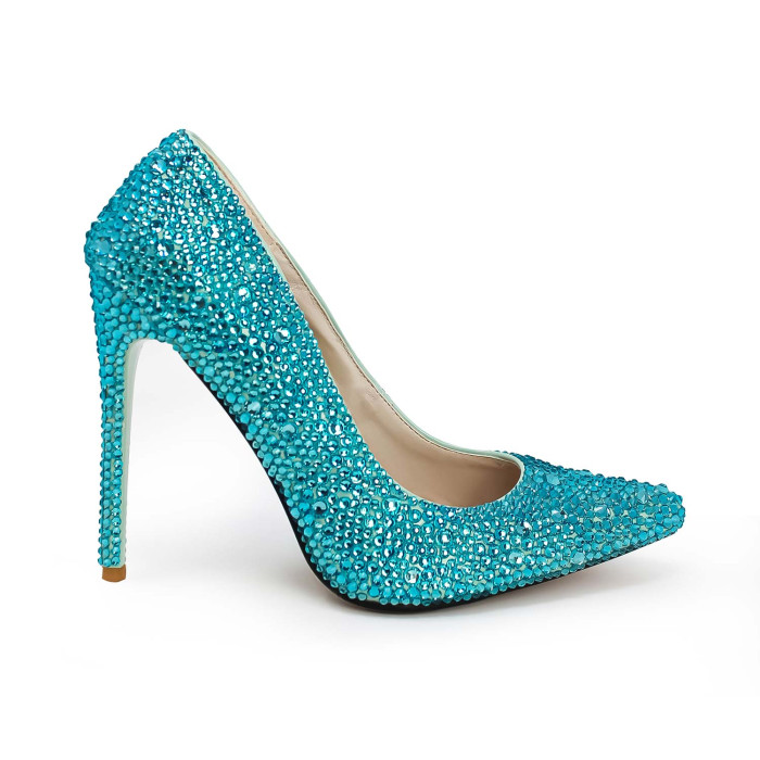 Aqua high heels covered in shimmering glass rhinestones with a pointed toe and a stiletto heel featuring a rubberized sole.