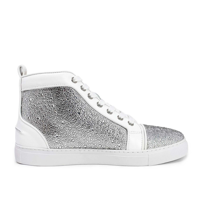 High-top sneakers with a white leather and suede base covered in silver glass rhinestones featuring a textured surface and white laces.