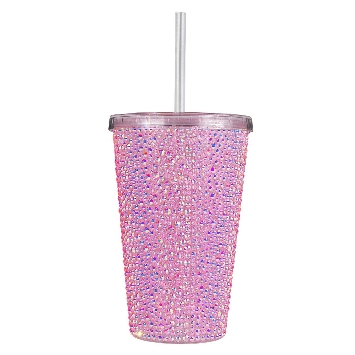 A pink acrylic tumbler covered in rhinestones featuring a silver lid and straw with a textured sparkling surface.