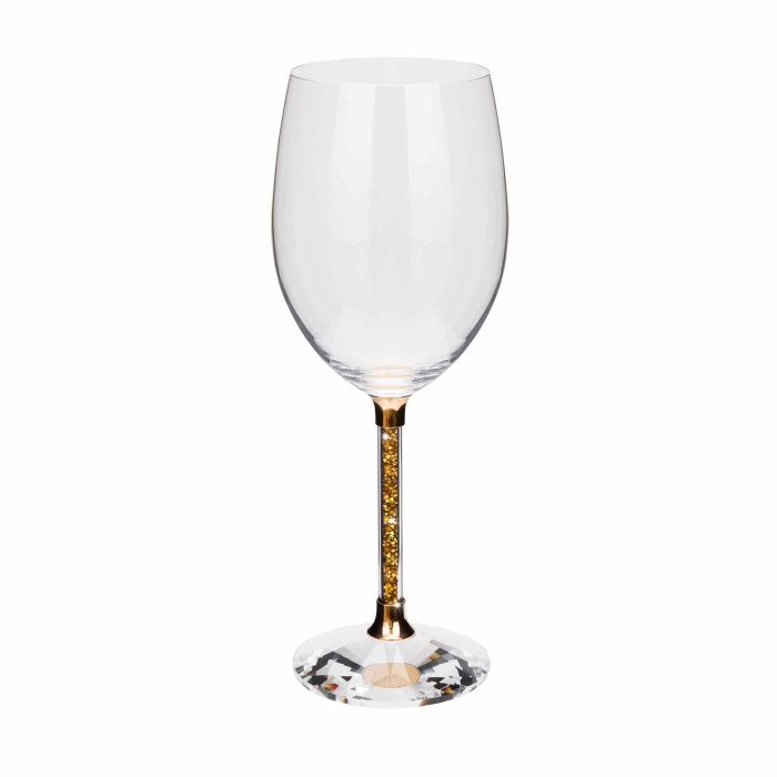 Clear crystal wine glass with a gold stem featuring yellow rhinestones and a faceted clear base.