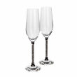 Clear crystal toasting flute with a black base and a glittering silver-filled stem measures 10"x3"x3". Clear crystal toasting flute with a black base and a glittering silver-filled stem measures 10"x3"x3".