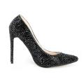 Aqua high-heeled pump covered in shimmering glass rhinestones with a pointed toe and a rubberized sole. Aqua high-heeled pump covered in shimmering glass rhinestones with a pointed toe and a rubberized sole.