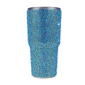 Rhinestone-encrusted double-walled stainless steel tumbler with a clear straw featuring a shimmering iridescent finish. Rhinestone-encrusted double-walled stainless steel tumbler with a clear straw featuring a shimmering iridescent finish.