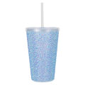 A pink acrylic tumbler covered in rhinestones featuring a silver lid and straw with a textured sparkling surface. A pink acrylic tumbler covered in rhinestones featuring a silver lid and straw with a textured sparkling surface.