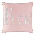 White velvet pillow with large rhinestone and faux pearl lettering spelling "FUCK" in silver embellishments.