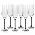 Clear crystal toasting flute with a black base and a glittering silver-filled stem measures 10"x3"x3".