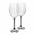 Clear crystal wine glass with a gold stem featuring yellow rhinestones and a faceted clear base. Clear crystal wine glass with a gold stem featuring yellow rhinestones and a faceted clear base.