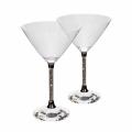 Clear crystal martini glass with a wide conical bowl a faceted base and a stem featuring embedded rhinestones.