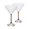 Clear crystal martini glass with a wide conical bowl a faceted base and a stem featuring embedded rhinestones.