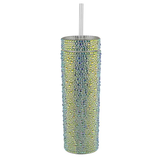 A tall silver tumbler covered in rhinestones with a clear straw and a smooth shiny surface. A tall silver tumbler covered in rhinestones with a clear straw and a smooth shiny surface.
