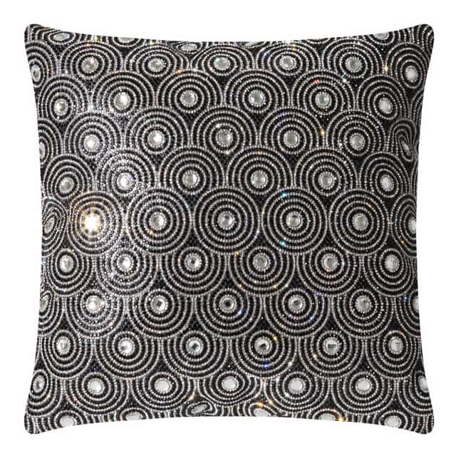 Black velvet pillow with circular glass rhinestone embellishments in an orbital pattern featuring a textured surface and plush shape. Black velvet pillow with circular glass rhinestone embellishments in an orbital pattern featuring a textured surface and plush shape.