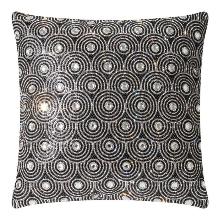 Black&#x20;velvet&#x20;pillow&#x20;with&#x20;circular&#x20;glass&#x20;rhinestone&#x20;embellishments&#x20;in&#x20;an&#x20;orbital&#x20;pattern&#x20;featuring&#x20;a&#x20;textured&#x20;surface&#x20;and&#x20;plush&#x20;shape.